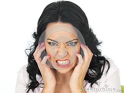 Portrait of an Angry Frustrated Young Hispanic Woman Clenching Stock Photo