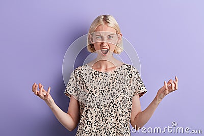 Portrait of an angry irritated girl hates somebody Stock Photo