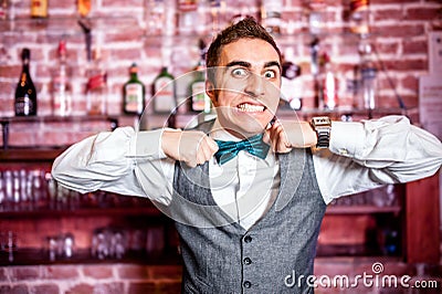 Portrait of angry and stressed bartender or barman with bowtie Stock Photo