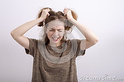 Portrait of an angry stressed dishevelled woman Stock Photo