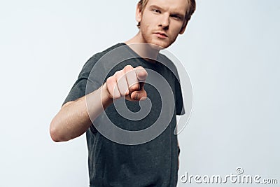 Portrait of Angry Young Man Pointing Forefinger Stock Photo