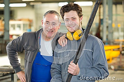 Portrait apprentice and engineer in factory Stock Photo