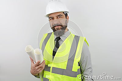 Portrait of an architect man wearing safety helmet and reflecting jacket holding blueprints Stock Photo