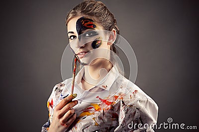 Portrait artist with stained face paints Stock Photo