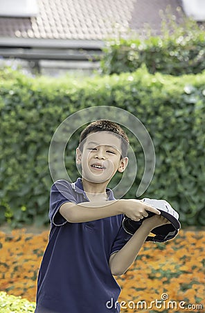 Portrait of Asean boy , laughing and smiling happily in the park Stock Photo