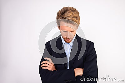 Portrait of ashamed young businessman looking down Stock Photo