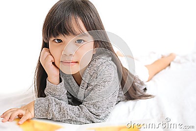 Portrait asia children, education and school concept -student girl reading book. Stock Photo