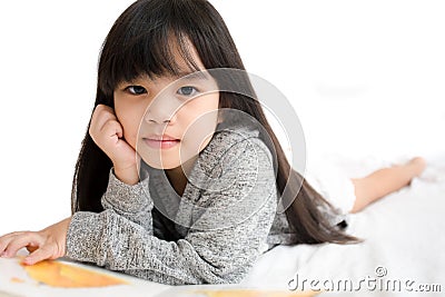 Portrait asia children, education and school concept -student girl reading book. Stock Photo