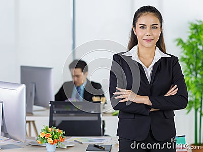 Portrait asian adult woman is office people wearing suit standing and folded cross his arms looking at camera look to confident. Stock Photo