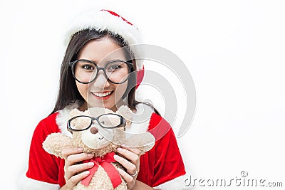 Portrait of asian beautiful woman wearing santa custume and glasses holding teddy bear Stock Photo
