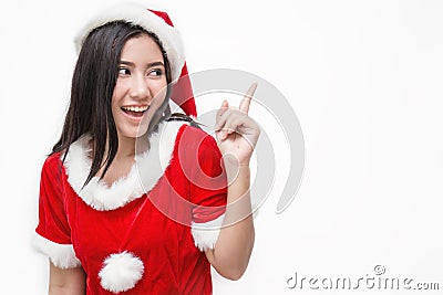 Portrait of asian beautiful woman wearing santa custume with her finger point up Stock Photo