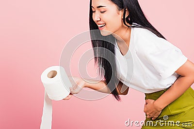 Woman diarrhea constipation holding stomachache and tissue toilet paper Stock Photo