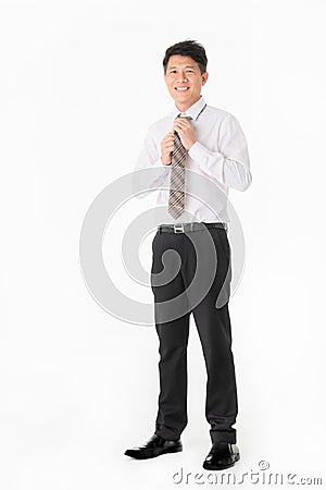 Portrait Asian Businessman stunning and smiling in shirt, looking at camera, isolated on white background Stock Photo