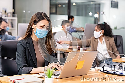 Portrait asian businesswoman working in new normal and social distance office Stock Photo