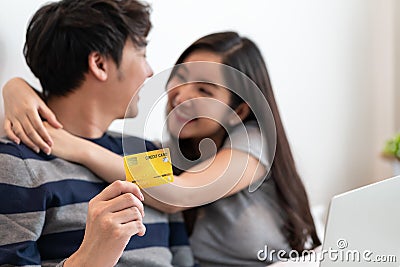 Portrait of a asian cheerful couple shopping onlin Stock Photo