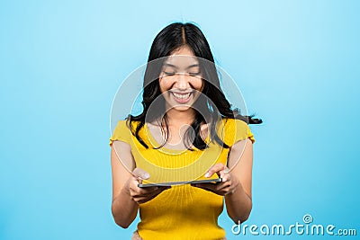 Portrait, Asian girl, was playing competitive game with friends on laptop very fun and it, causing laugh out loud, Stock Photo