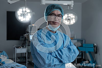 Diverse smiling female business colleagues walking and discussing paperwork in office Stock Photo