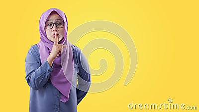 Muslim Lady Shushing Gesture Stock Photo