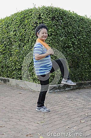 Portrait of Asian Senior Stretching Stock Photo