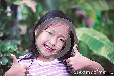 Portrait asian smile little girls with very good sign Stock Photo