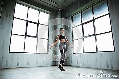 Woman jumping rope in the gym Stock Photo