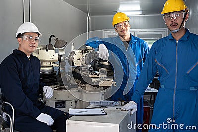 Portrait of Asian team maintenance engineer workers working machines in the factory. Stock Photo