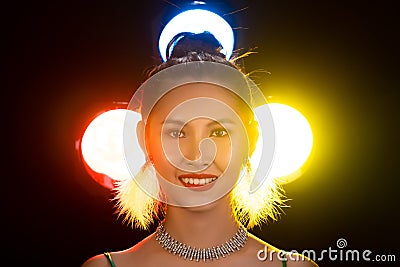 Portrait of Asian Woman Transgender wear Beautiful Green Evening long Gown, smile to camera over Back Lights colorful yellow, red Stock Photo