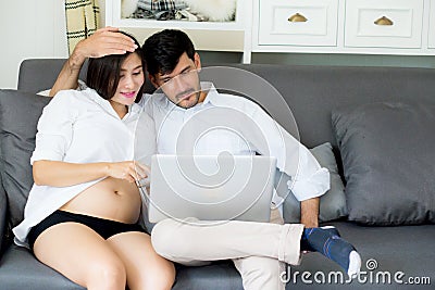 Portrait of a asian young couple husband and wife sitting. Stock Photo