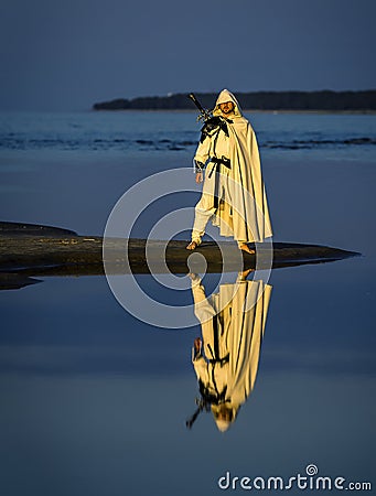 Portrait of assassin in white costume. Stock Photo