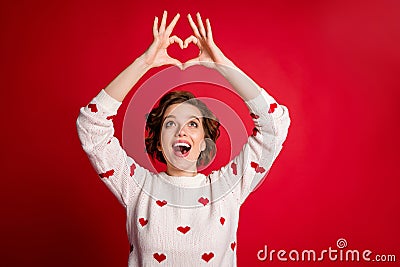 Portrait of astonished girl make heart hands enjoy passionate love sign look impressed scream wow omg wear white jumper Stock Photo