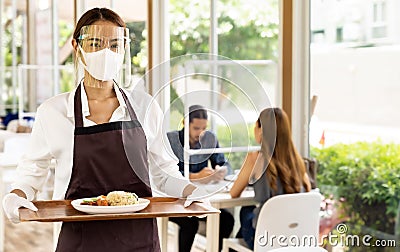 Asian waitress serving food new normal Stock Photo