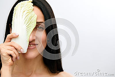 portrait of attractive caucasian smiling woman isolated on white studio shot eating salat Stock Photo
