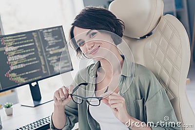 Portrait of attractive experienced skilled cheery girl technician html coder hacker expert at work place space indoors Stock Photo