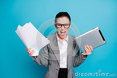 Portrait of attractive furious mad crazy lady specialist managing documentation burn-out isolated on bright blue color Stock Photo