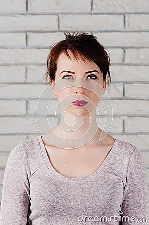 Portrait of attractive girl with face mimic, showing exercise for face fitness Stock Photo