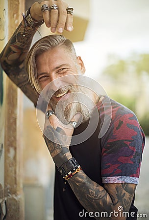 Portrait of an attractive happy hipster in the city on a sunny day Stock Photo