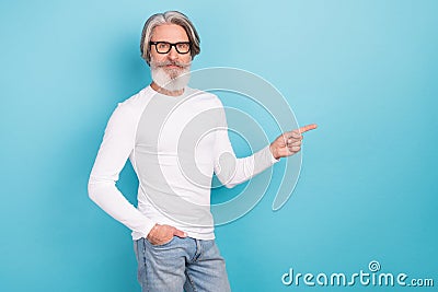 Portrait of attractive intellectual grey-haired man demonstrating ad copy space idea isolated over vivid blue color Stock Photo