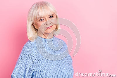 Portrait of attractive kind nice cheery grey-haired woman wearing pullover copy space isolated over pink pastel color Stock Photo