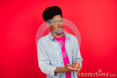 Portrait of attractive moody mad brunet guy saying pretense bad mood break up isolated over bright red color background Stock Photo