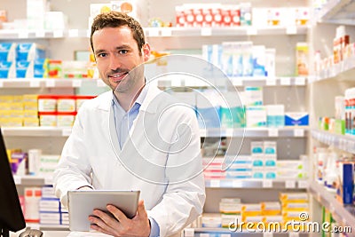 Portrait of an attractive pharmacist at work Stock Photo