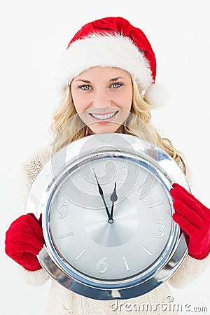 Portrait of attractive santa woman holding clock Stock Photo