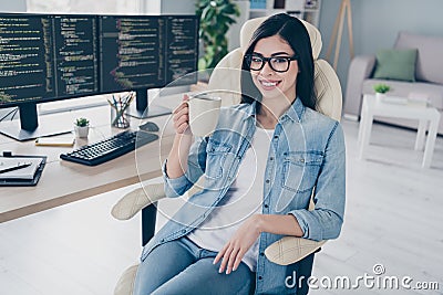 Portrait of attractive smart clever cheerful girl tech expert leader editing web source drinking tea at work place Stock Photo