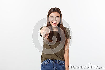 Portrait of attractive smile laugh teenage girl, pointing her finger, wear green shirt, white teeth, brown long hair Stock Photo