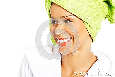 Portrait of attractive smiling woman wrapped in towel with turban. Stock Photo