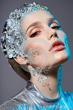 Portrait of attractive woman with decorative silver foil Stock Photo