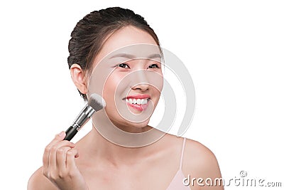 Portrait of attractive young asian woman holding make-up brushs Stock Photo