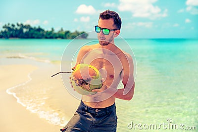 Portrait of an attractive young man on a tropical beach Stock Photo