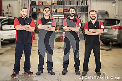 Portrait of auto shop mechanics group together employee Stock Photo