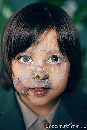 portrait of baby boy smeared cake Stock Photo