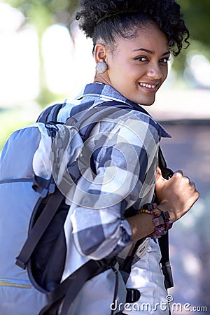 Portrait, backpack and happy student at park, university or outdoor campus in summer. Face, bag and smile of woman at Stock Photo